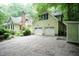 Home features a two car garage, new gravel driveway, and bonus storage shed at 7216 Rabbit Run, Wake Forest, NC 27587