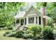 Charming two-story home featuring a well-manicured lawn and an inviting front porch at 7216 Rabbit Run, Wake Forest, NC 27587