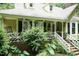 Charming home with a welcoming porch and lush landscaping, creating a cozy and inviting atmosphere at 7216 Rabbit Run, Wake Forest, NC 27587