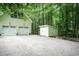 Home with a detached two-car garage and a separate shed with gravel driveway at 7216 Rabbit Run, Wake Forest, NC 27587