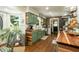 Rustic kitchen features wood counters, green cabinets, stainless appliances, farmhouse sink, and brick accent wall at 7216 Rabbit Run, Wake Forest, NC 27587