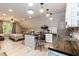 Inviting kitchenette with an island, stainless steel appliances, and a view into the cozy living area at 7216 Rabbit Run, Wake Forest, NC 27587