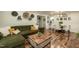 Open-concept living room and dining area with comfortable seating and stylish decor, ideal for entertaining at 7216 Rabbit Run, Wake Forest, NC 27587
