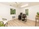 Bright, minimalist office space featuring wood flooring, natural light, and a functional work area with dual monitors at 7216 Rabbit Run, Wake Forest, NC 27587