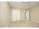 This bedroom features neutral walls, carpet, and a ceiling fan, along with ample closet space at 747 Weathergreen Dr, Raleigh, NC 27615