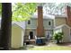 Exterior of the house with a deck, chimney, and trash bins at 747 Weathergreen Dr, Raleigh, NC 27615