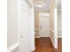 Bright foyer featuring hardwood floors and white trim, creating a welcoming entrance to the home at 747 Weathergreen Dr, Raleigh, NC 27615