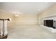 Bright living room with carpet floors, fireplace, and chandelier lighting at 747 Weathergreen Dr, Raleigh, NC 27615