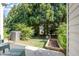Spacious backyard with mature trees and lush landscaping, ideal for outdoor enjoyment and relaxation at 7648 Winners Edge St, Raleigh, NC 27617