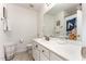 Bright bathroom featuring white cabinets, neutral tile flooring and a shower/tub combo at 7648 Winners Edge St, Raleigh, NC 27617