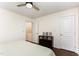 Bedroom with hardwood floors and three framed pictures on a dresser at 7648 Winners Edge St, Raleigh, NC 27617