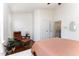 Bright bedroom with hardwood floors, chair and bathroom access at 7648 Winners Edge St, Raleigh, NC 27617