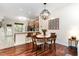 Cozy dining area adjacent to the kitchen, featuring a breakfast bar and modern lighting at 7648 Winners Edge St, Raleigh, NC 27617
