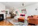 Open-concept living room featuring a colorful rug, modern furnishings, and plenty of natural light at 7648 Winners Edge St, Raleigh, NC 27617