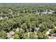 Aerial view of a lakefront neighborhood with beautiful homes nestled among mature trees at 81106 Alexander, Chapel Hill, NC 27517