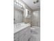 Bright bathroom features a white vanity, a mirrored medicine cabinet and a glass-enclosed shower at 81106 Alexander, Chapel Hill, NC 27517