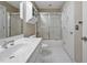 Bright bathroom featuring a white vanity, mirrored medicine cabinet, and a glass-enclosed shower at 81106 Alexander, Chapel Hill, NC 27517