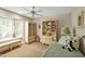 Bedroom with neutral paint, plush carpeting, ceiling fan, and bright window at 81106 Alexander, Chapel Hill, NC 27517