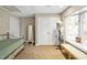 Spare bedroom featuring a bench seat, large windows, and neutral carpeting at 81106 Alexander, Chapel Hill, NC 27517
