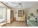 Cozy bedroom with carpet, ceiling fan, bamboo-style furniture, and ample natural light at 81106 Alexander, Chapel Hill, NC 27517