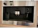 A stainless steel Miele coffee maker is featured in the kitchen at 81106 Alexander, Chapel Hill, NC 27517