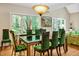 Dining room with a glass table, velvet chairs, and natural light at 81106 Alexander, Chapel Hill, NC 27517