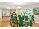Dining room with a glass table, velvet chairs, and light fixture at 81106 Alexander, Chapel Hill, NC 27517