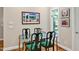 Cozy dining room with a glass table and seating for four near a bright window at 81106 Alexander, Chapel Hill, NC 27517