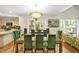 Bright dining area adjacent to the kitchen with a glass table and seating for eight at 81106 Alexander, Chapel Hill, NC 27517