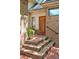 Brick steps leading to front entrance with potted plant, red framed door, and black hand railing at 81106 Alexander, Chapel Hill, NC 27517