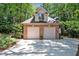 Charming two-story brick home with a two-car garage nestled among mature trees at 81106 Alexander, Chapel Hill, NC 27517