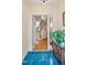 Foyer with view of wooden staircase, hardwood floors, and elegant console table with indoor plant at 81106 Alexander, Chapel Hill, NC 27517