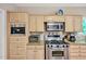 A beautifully appointed kitchen with stainless steel appliances and custom cabinetry at 81106 Alexander, Chapel Hill, NC 27517