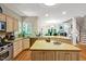 Spacious kitchen featuring granite countertops, stainless steel appliances, and a kitchen island with sink at 81106 Alexander, Chapel Hill, NC 27517