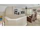 Upstairs media area with a ceiling fan, built-in shelving, and comfortable seating at 81106 Alexander, Chapel Hill, NC 27517