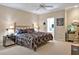 Bright main bedroom with ensuite bathroom access, neutral color palette and ceiling fan to keep the room cool at 81106 Alexander, Chapel Hill, NC 27517