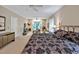 Large main bedroom featuring a cozy seating area around a fireplace and a ceiling fan, perfect for relaxation at 81106 Alexander, Chapel Hill, NC 27517
