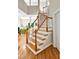 Bright, naturally lit staircase with hardwood steps and painted white risers and spindles at 81106 Alexander, Chapel Hill, NC 27517