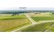 Aerial view of home with surrounding property, fields, and nearby roads at 82 Mamie Rd, Benson, NC 27504