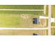 Bird's eye view of house situated on large lot, showcasing driveway and open land at 82 Mamie Rd, Benson, NC 27504
