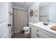 Bathroom with modern fixtures, vanity, and decorative accents above the toilet at 82 Mamie Rd, Benson, NC 27504