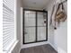 Bathroom featuring a black framed glass enclosed shower and natural light at 82 Mamie Rd, Benson, NC 27504