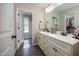 Bathroom with double sink vanity and a view into a walk-in closet at 82 Mamie Rd, Benson, NC 27504