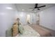 Bright bedroom featuring neutral tones, plush pillows, and a ceiling fan at 82 Mamie Rd, Benson, NC 27504