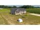 Back and side view of home showing yard at 82 Mamie Rd, Benson, NC 27504