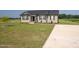 Home with driveway and manicured front yard and garden at 82 Mamie Rd, Benson, NC 27504