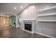 Spacious living room featuring a fireplace, vaulted ceilings, and hardwood floors at 82 Mamie Rd, Benson, NC 27504