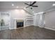 Spacious living room featuring a fireplace, vaulted ceilings, and hardwood floors at 82 Mamie Rd, Benson, NC 27504