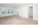 Bright bedroom with carpet, white trim, large windows and an ensuite entrance at 835 New Derby Ln, Apex, NC 27523
