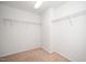 Walk-in closet with carpeted floor, wire shelving, and overhead lighting at 835 New Derby Ln, Apex, NC 27523